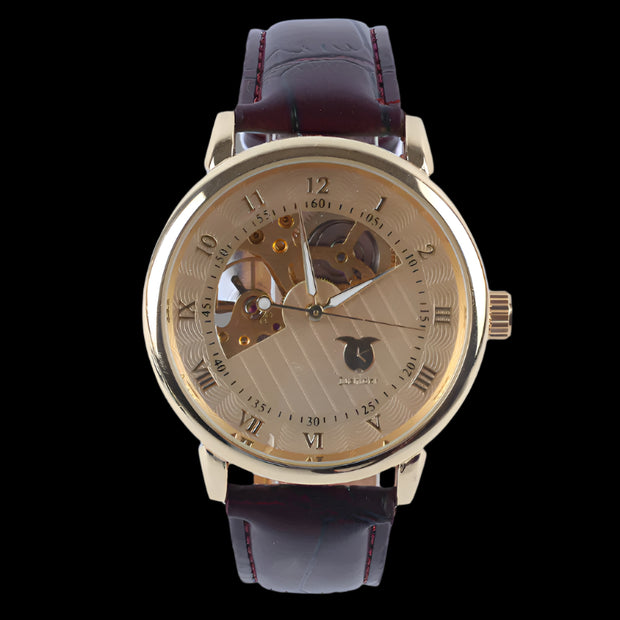 Luxury gold-tone watch with a skeleton dial and leather strap, showcasing refined craftsmanship and style.