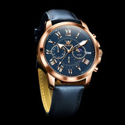Luxury men’s sports watch with black leather strap, rose gold case, and sleek blue dial featuring chronograph functionality.